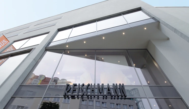 fashion store for sports and trends - reconstruction - Reischmann Sport Kempten - outside facade - entrance area - glass wall elements - logo sign